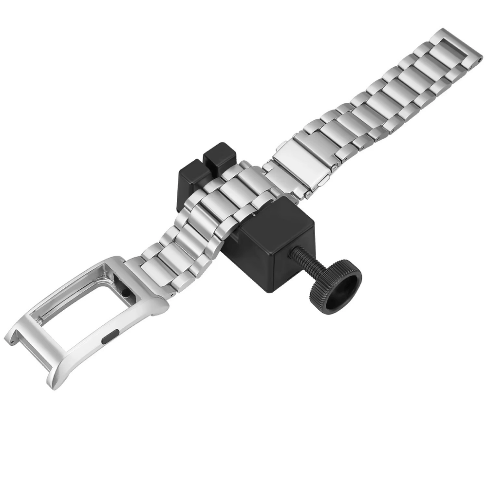 Ajustador de eslabones colocado en un brazalete de acero para reloj